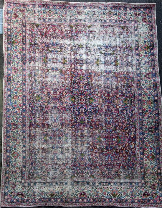 A Kirman ivory ground carpet,